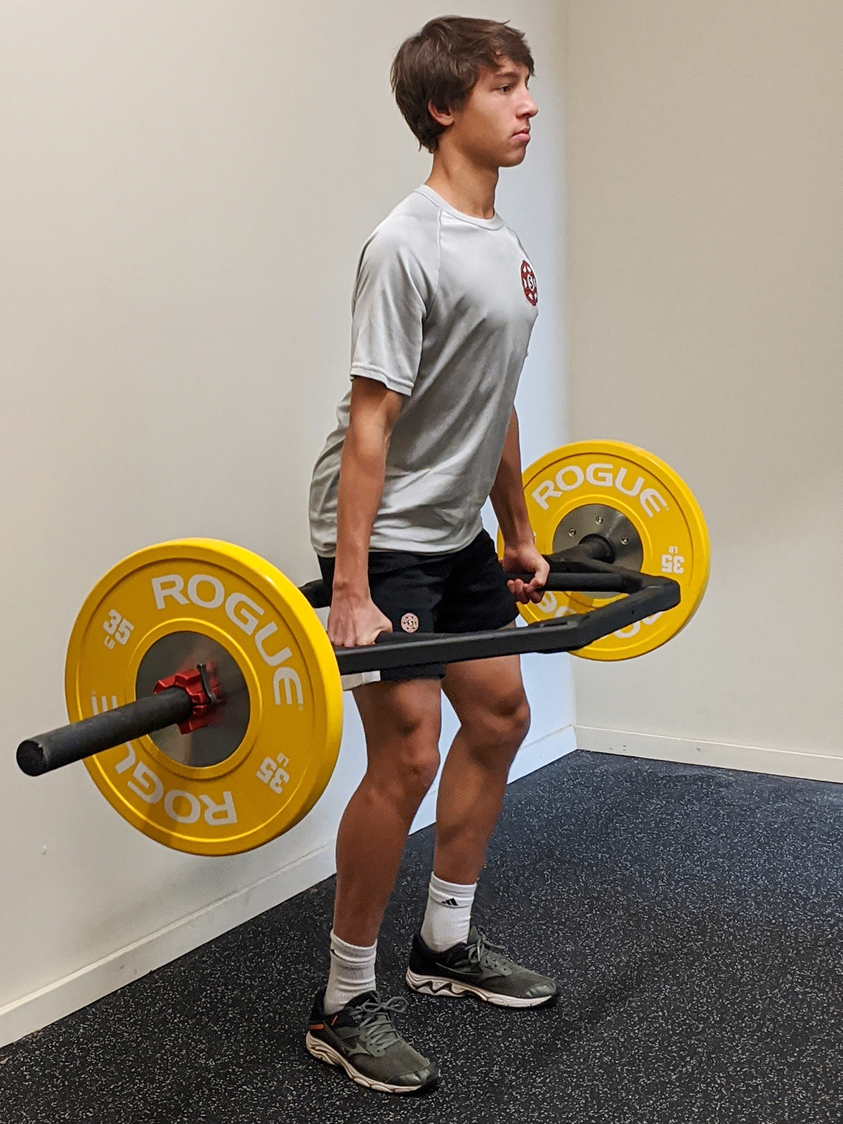 Young athlete practicing deadlift