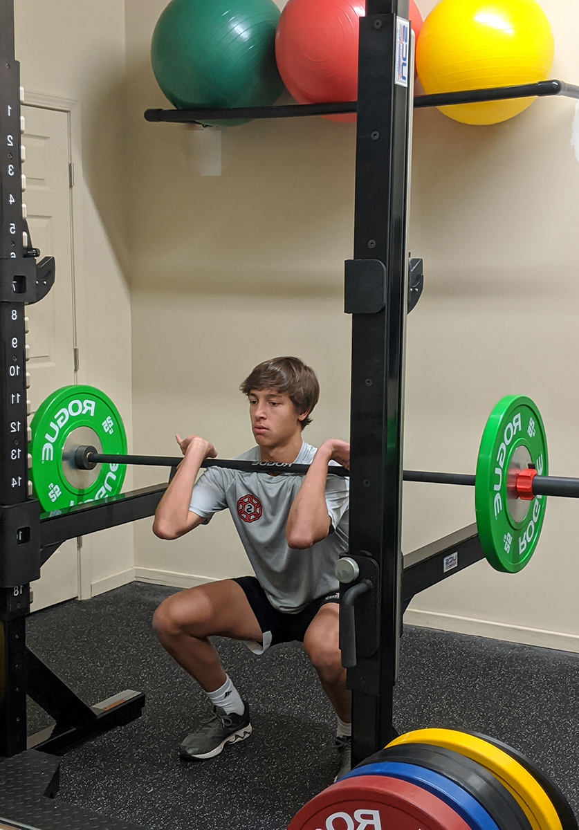 Squats with barbell on chest