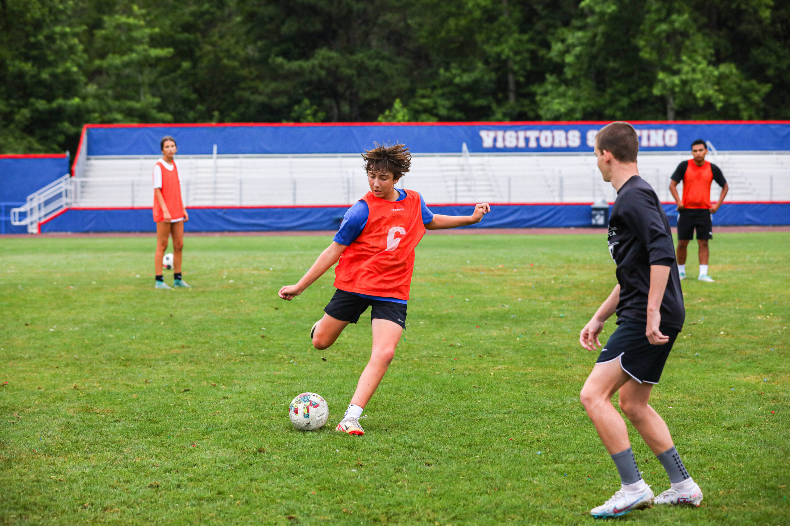 Youth soccer players participating in a small group training session focused on technical development, decision-making, and game performance.